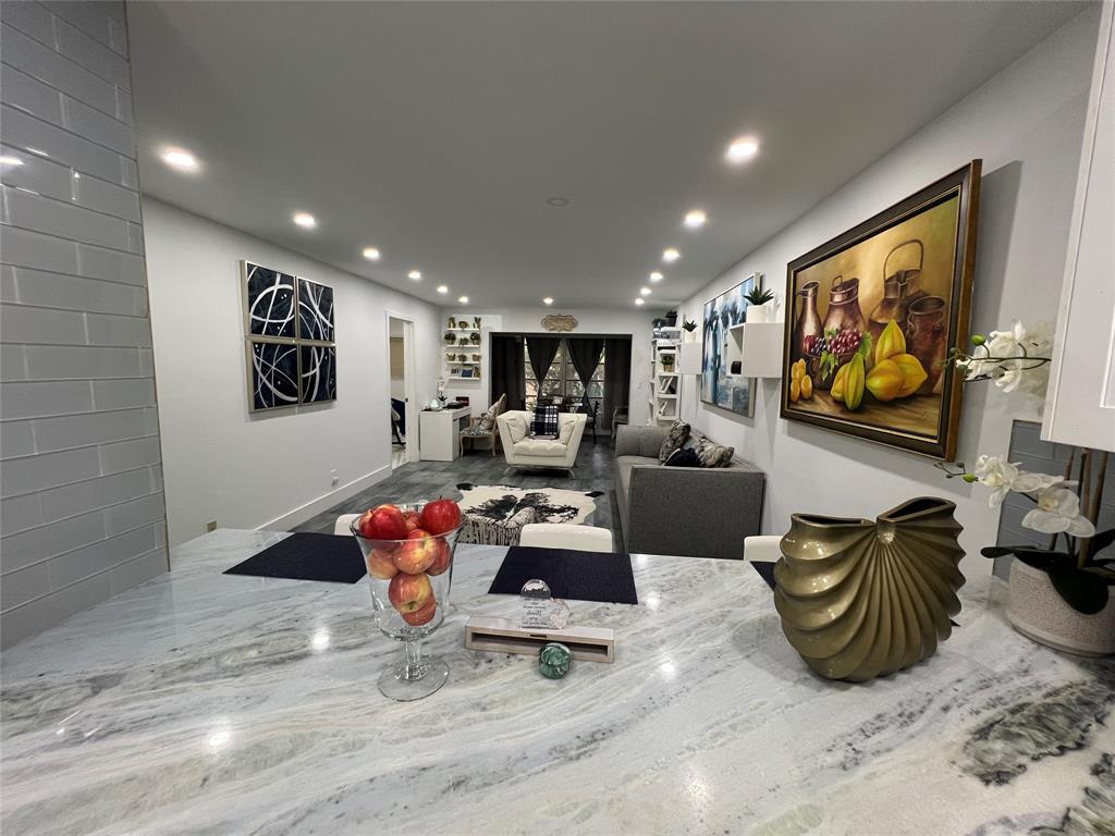 400 Northeast 20th Street, Unit C115 Boca Raton, FL 33431 - Photo 15 of 33 a living room with furniture and a flat screen tv