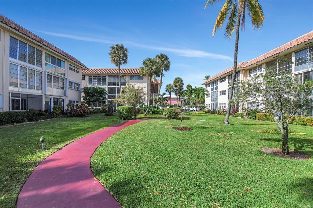 400 Northeast 20th Street, Unit C115 Boca Raton, FL 33431 - Photo 22 of 33 a view of a house with a yard