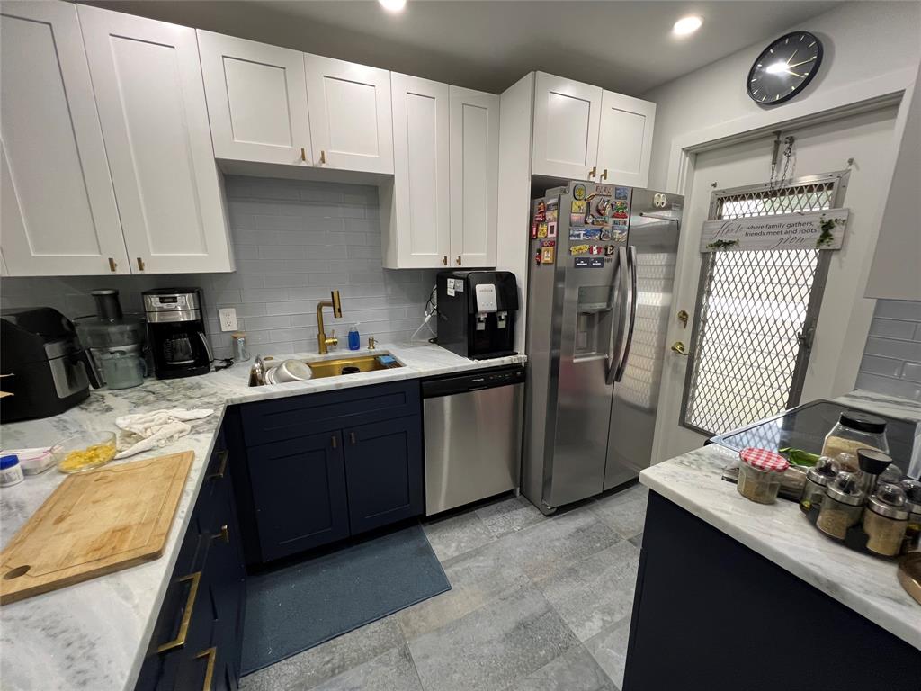 400 Northeast 20th Street, Unit C115 Boca Raton, FL 33431 - Photo 3 of 33 a kitchen with stainless steel appliances granite countertop a refrigerator stove sink and cabinets