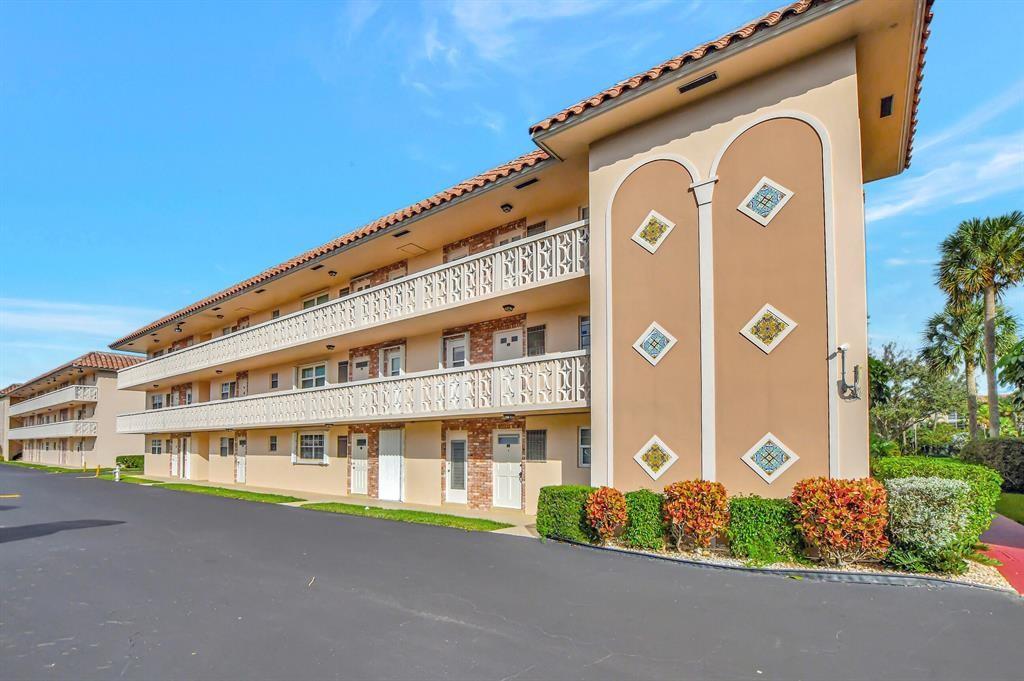 400 Northeast 20th Street, Unit C115 Boca Raton, FL 33431 - Photo 31 of 33 a front view of a building with a street