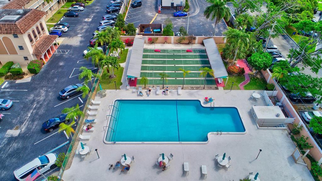 400 Northeast 20th Street, Unit C115 Boca Raton, FL 33431 - Photo 33 of 33 view of house with outdoor space and seating area