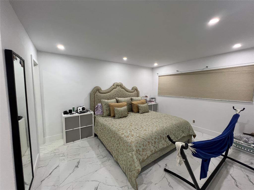 400 Northeast 20th Street, Unit C115 Boca Raton, FL 33431 - Photo 5 of 33 a bed room with a bed and furniture