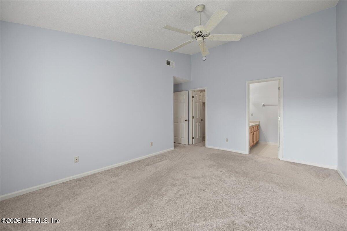 106 Ponte Vedra Colony Circle Ponte Vedra Beach, FL 32082 - Photo 18 of 30 an empty room with a ceiling fan and window