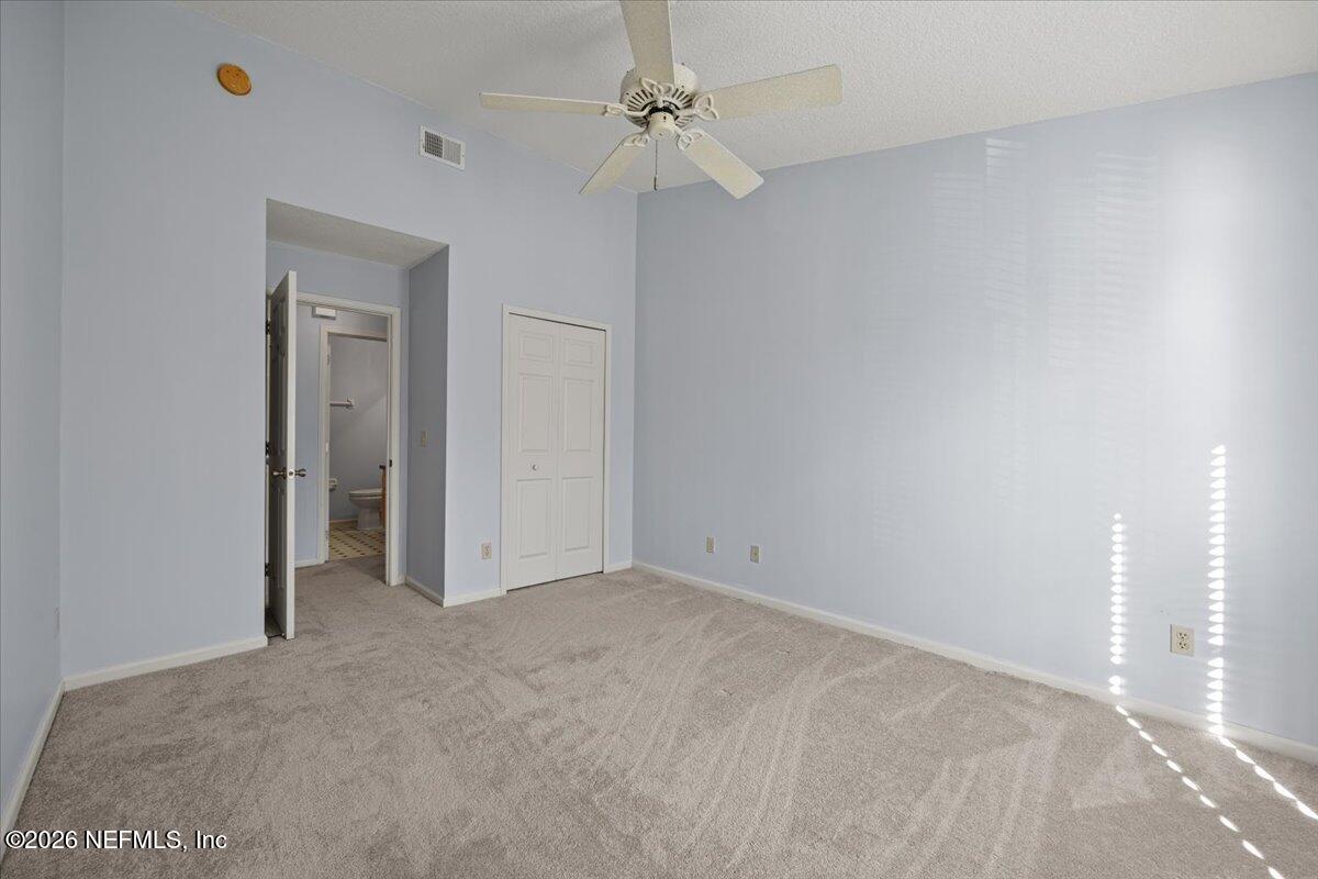 106 Ponte Vedra Colony Circle Ponte Vedra Beach, FL 32082 - Photo 27 of 30 an empty room with a ceiling fan and a window