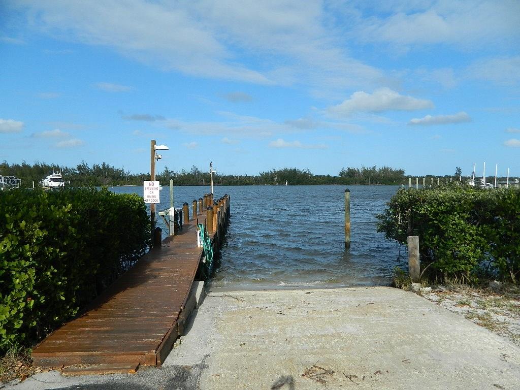 5702 Southeast Hull Street Stuart, FL 34997 - Photo 11 of 12 a view of a lake with a outdoor space