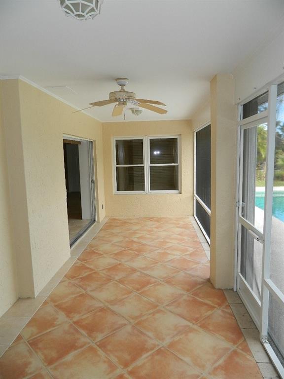 5702 Southeast Hull Street Stuart, FL 34997 - Photo 3 of 12 a view of an empty room with a window