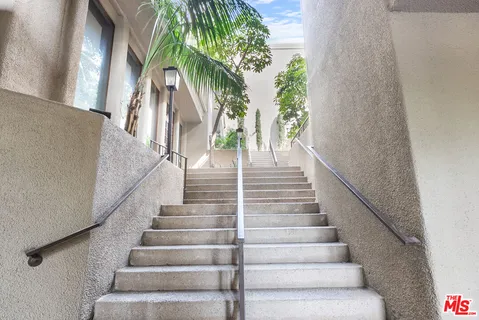 a view of staircase with lots of white walls