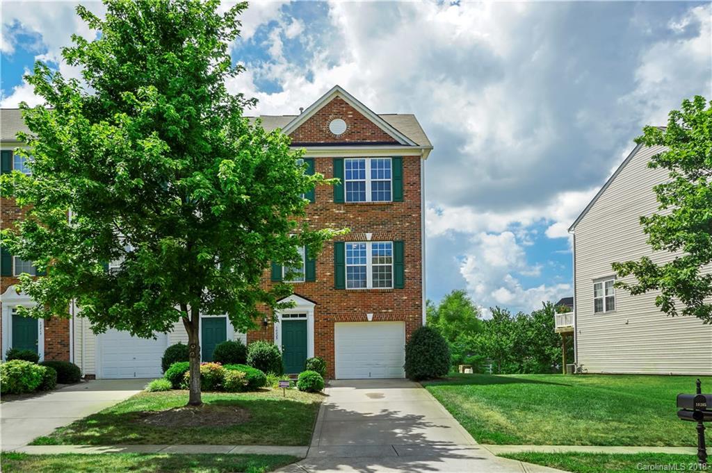 10225 Garrett Grigg Road Charlotte, NC 28262 - Photo 2 of 30 a front view of a house with a yard and potted plants