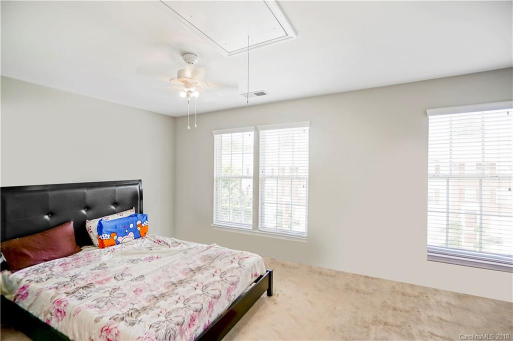 10225 Garrett Grigg Road Charlotte, NC 28262 - Photo 15 of 30 a bedroom with a bed and a window
