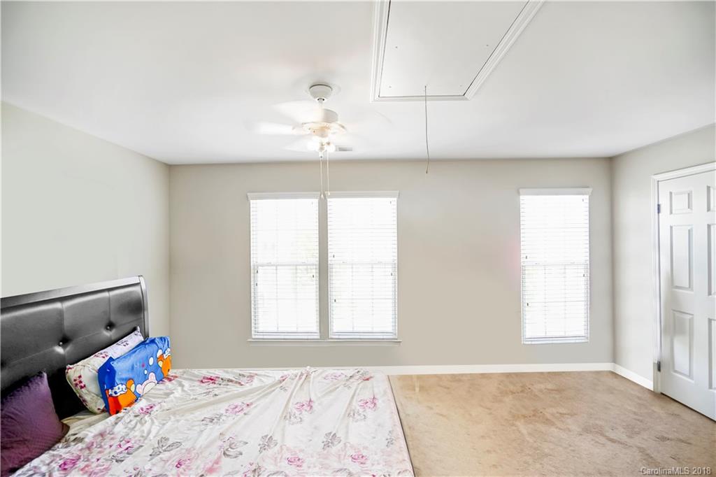 10225 Garrett Grigg Road Charlotte, NC 28262 - Photo 16 of 30 a bedroom with a bed and a window