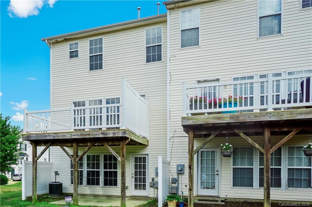 10225 Garrett Grigg Road Charlotte, NC 28262 - Photo 29 of 30 a view of large building with a door and deck