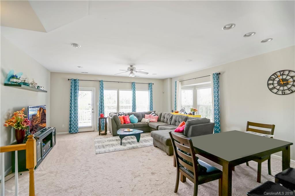 10225 Garrett Grigg Road Charlotte, NC 28262 - Photo 5 of 30 a living room with furniture a window and a table