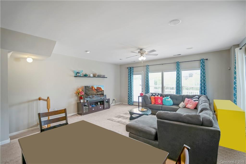 10225 Garrett Grigg Road Charlotte, NC 28262 - Photo 8 of 30 a living room with furniture and a large window