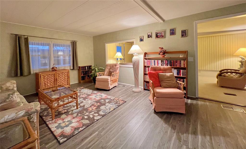1100 South Belcher Road, Unit 190 Largo, FL 33771 - Photo 13 of 48 a living room with furniture rug and window