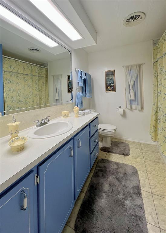 1100 South Belcher Road, Unit 190 Largo, FL 33771 - Photo 16 of 48 a spacious bathroom with a granite countertop sink a mirror and a
