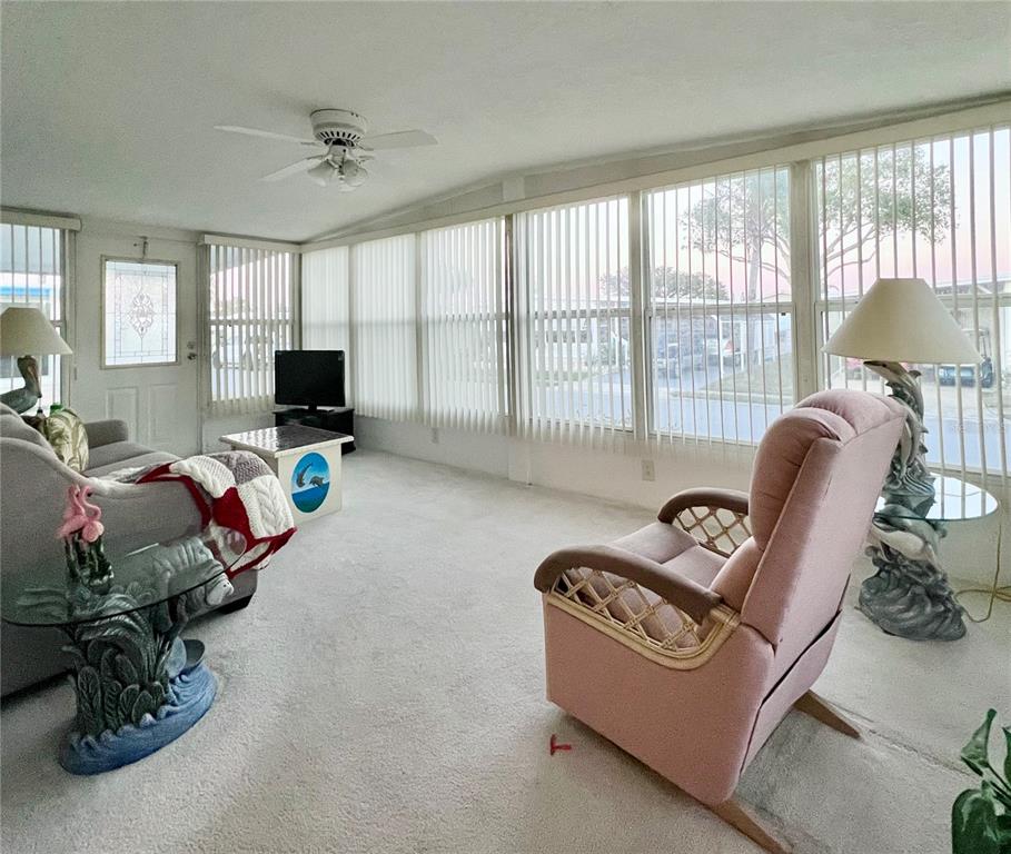 1100 South Belcher Road, Unit 190 Largo, FL 33771 - Photo 5 of 48 a living room with furniture and a flat screen tv