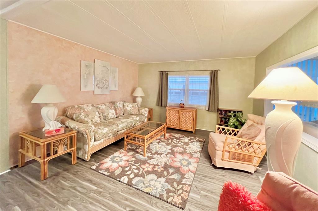 1100 South Belcher Road, Unit 190 Largo, FL 33771 - Photo 8 of 48 a living room with furniture and a window
