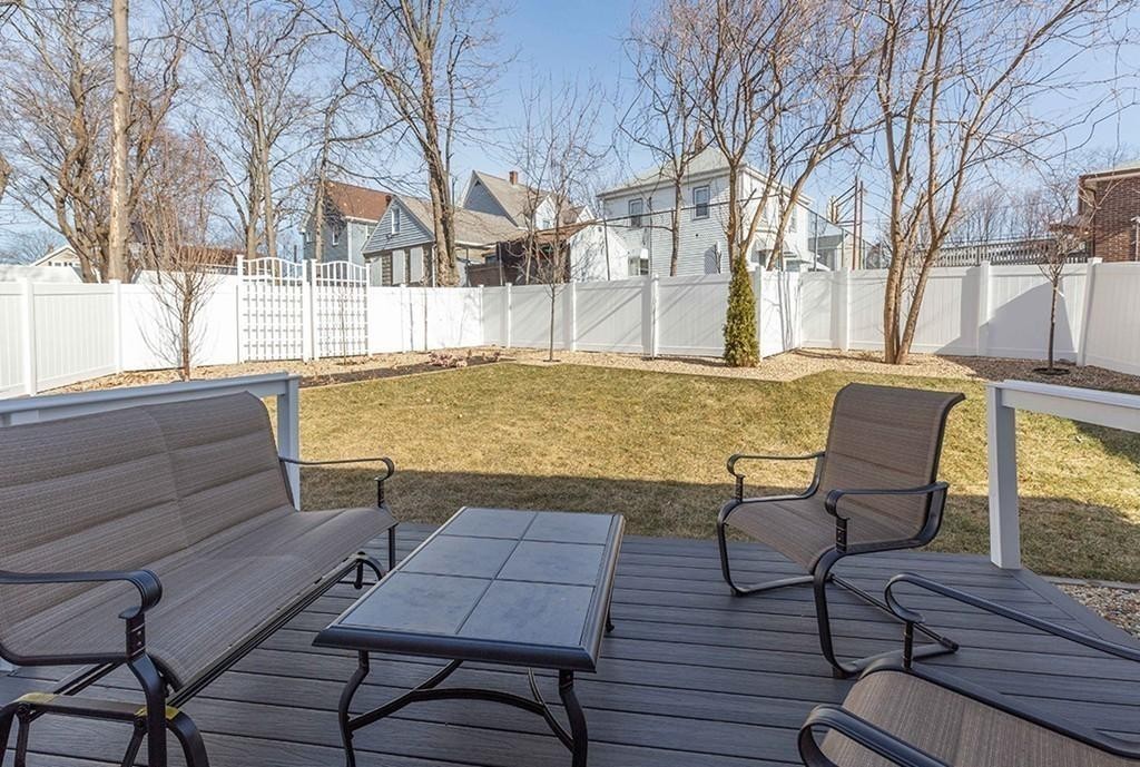 135 Sumner Street, Unit 1 Quincy, MA 02169 - Photo 11 of 13 a view of a chairs and table on the wooden floor