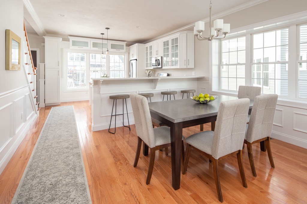 135 Sumner Street, Unit 1 Quincy, MA 02169 - Photo 4 of 13 a view of a dining room with furniture and wooden floor