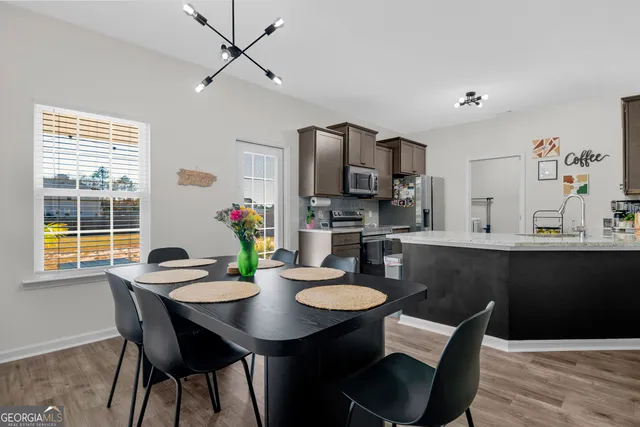 a view of a dining room with furniture