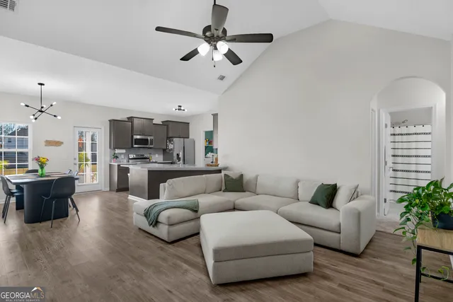 a living room with furniture and a flat screen tv