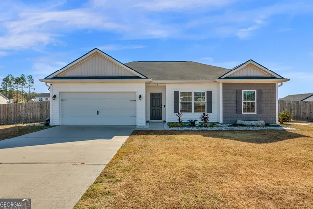 front view of a house with a yard