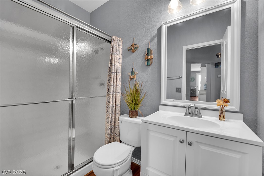 1724 Millstream Way Henderson, NV 89074 - Photo 21 of 60 A well-appointed bathroom features a modern vanity and convenient shower enclosure.