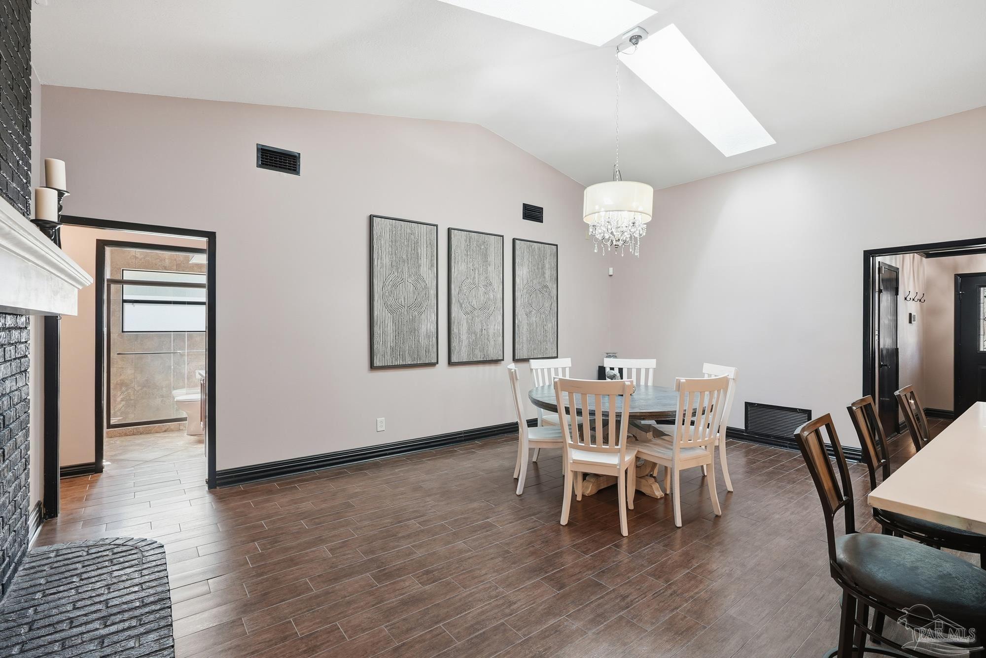 10145 Huntsman Path Pensacola, FL 32514 - Photo 13 of 47 a dining room with furniture and wooden floor
