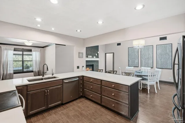 a kitchen with a sink stove and cabinets
