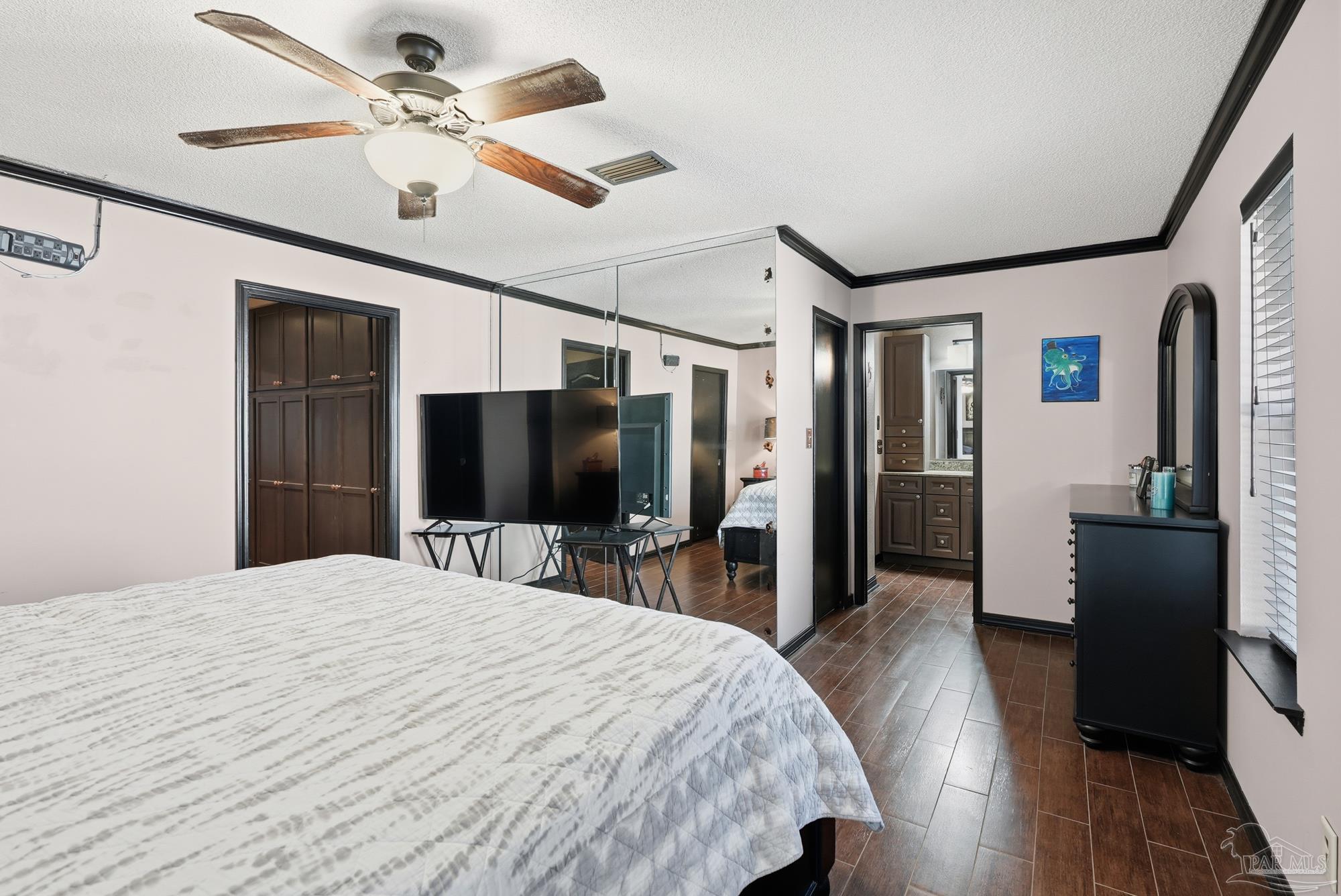 10145 Huntsman Path Pensacola, FL 32514 - Photo 19 of 47 a bedroom with a bed and a flat screen tv