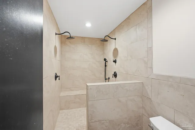 a bathroom with a bathtub and a shower