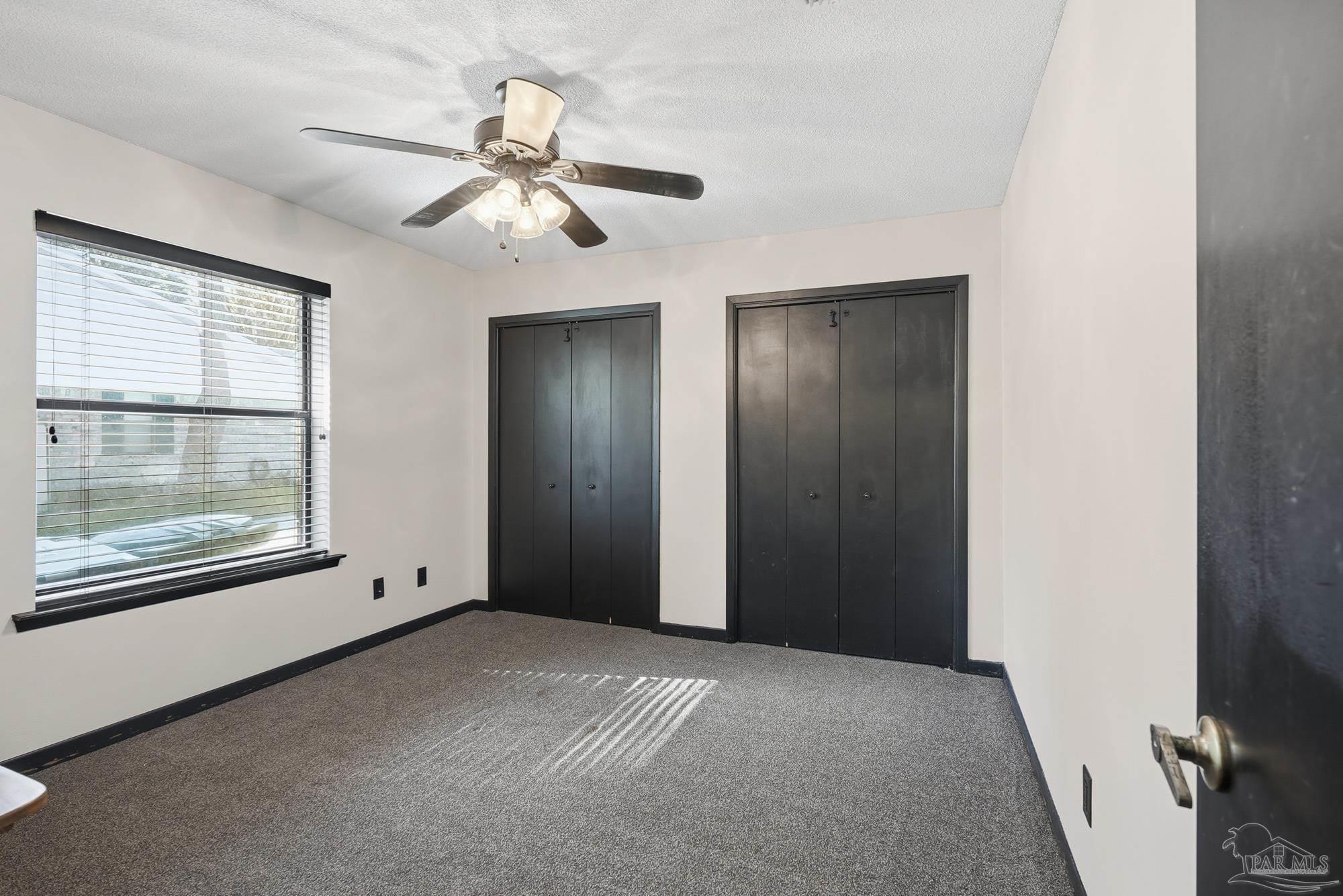 10145 Huntsman Path Pensacola, FL 32514 - Photo 22 of 47 a view of an empty room with a window