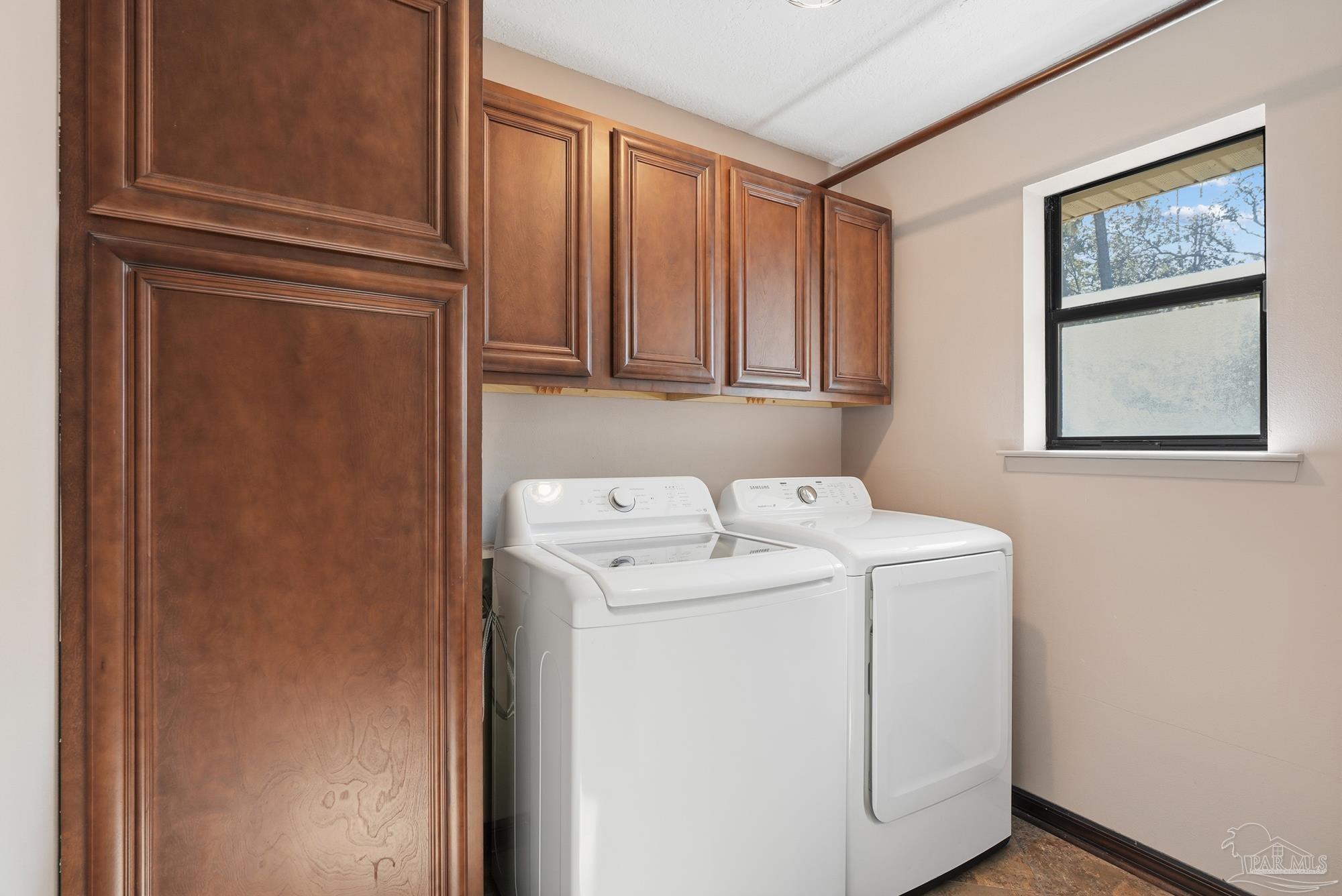 10145 Huntsman Path Pensacola, FL 32514 - Photo 25 of 47 a utility room with dryer and washer