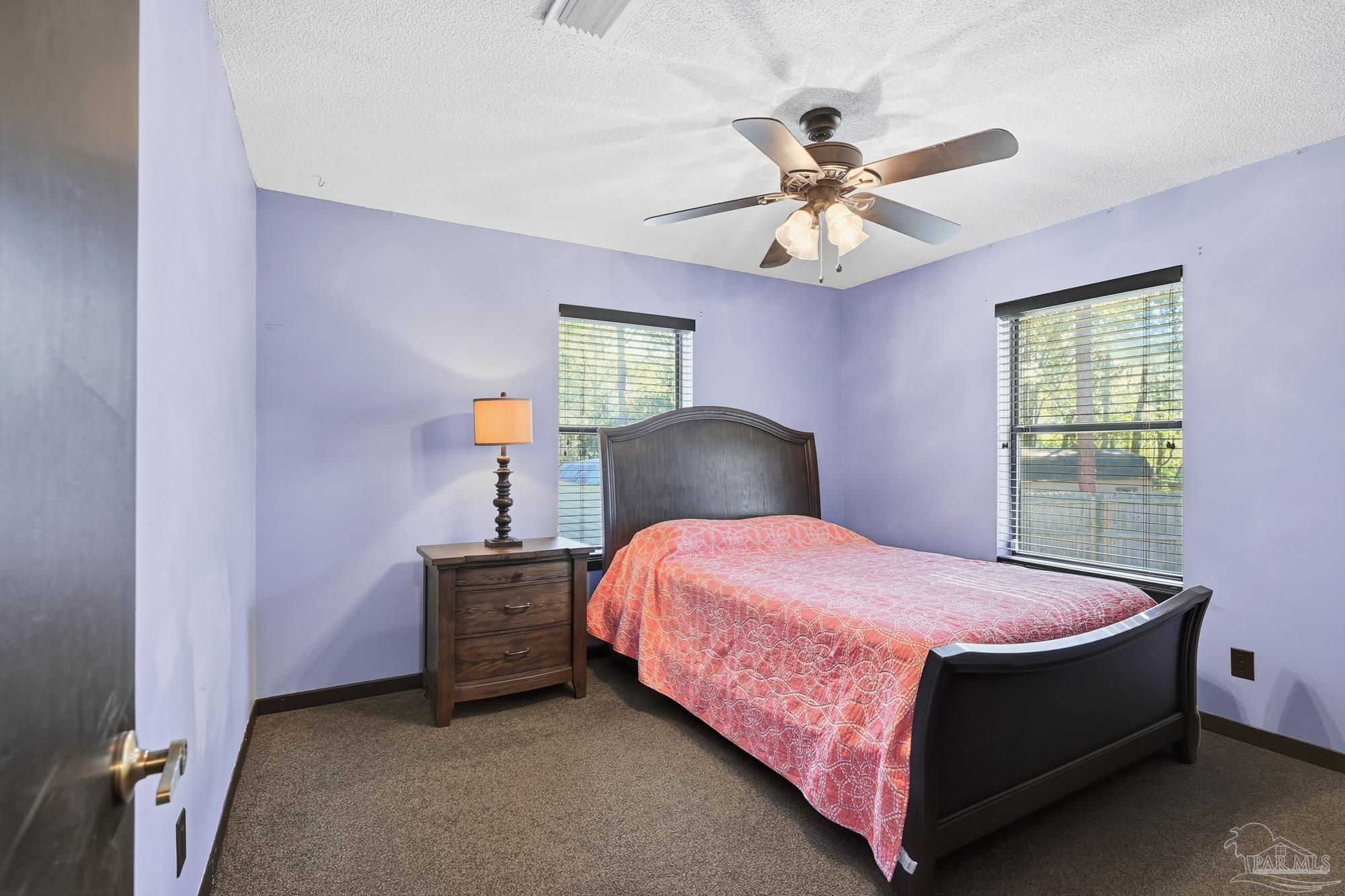 10145 Huntsman Path Pensacola, FL 32514 - Photo 26 of 47 a bedroom with a bed and window
