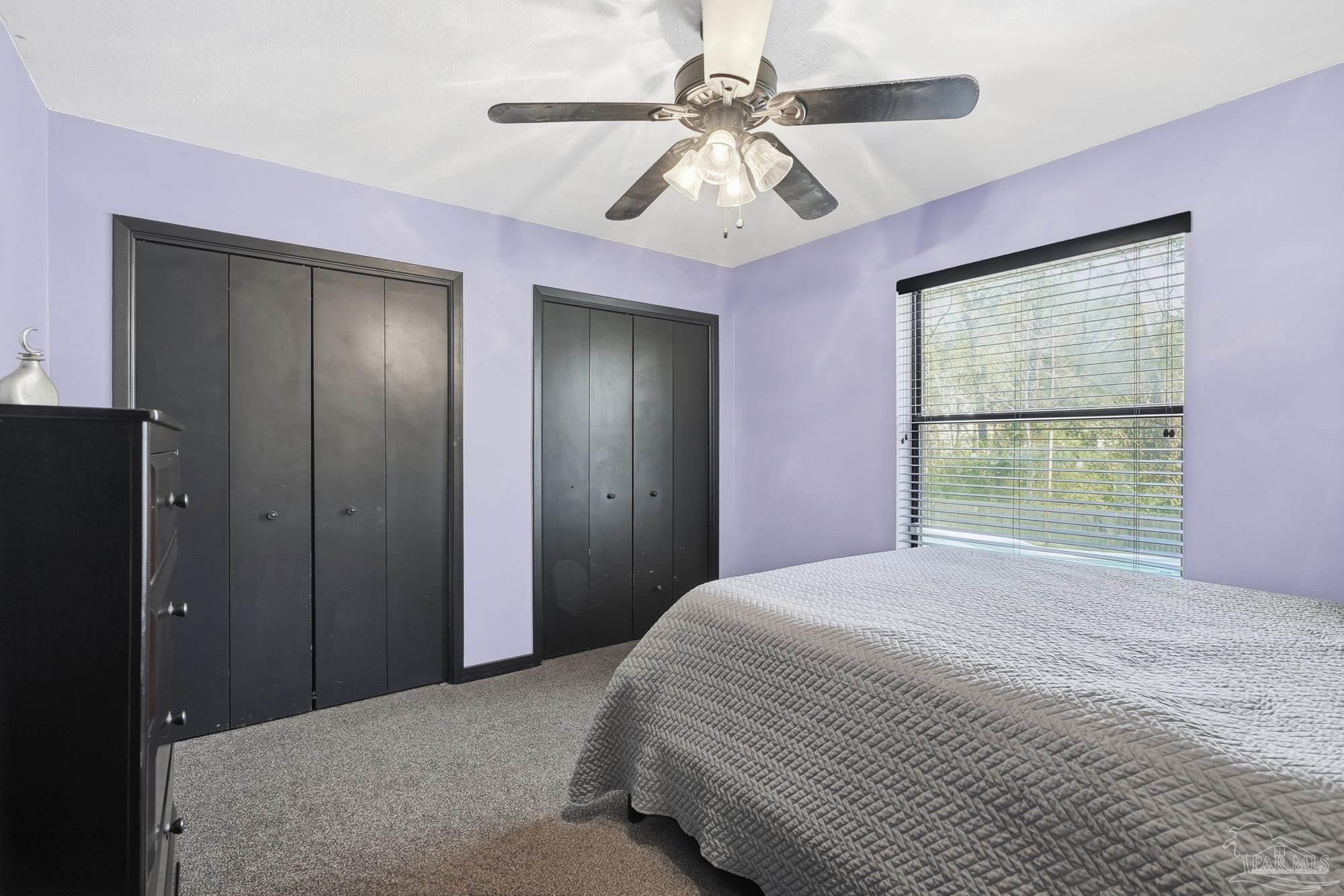 10145 Huntsman Path Pensacola, FL 32514 - Photo 28 of 47 a bedroom with a large bed and a window