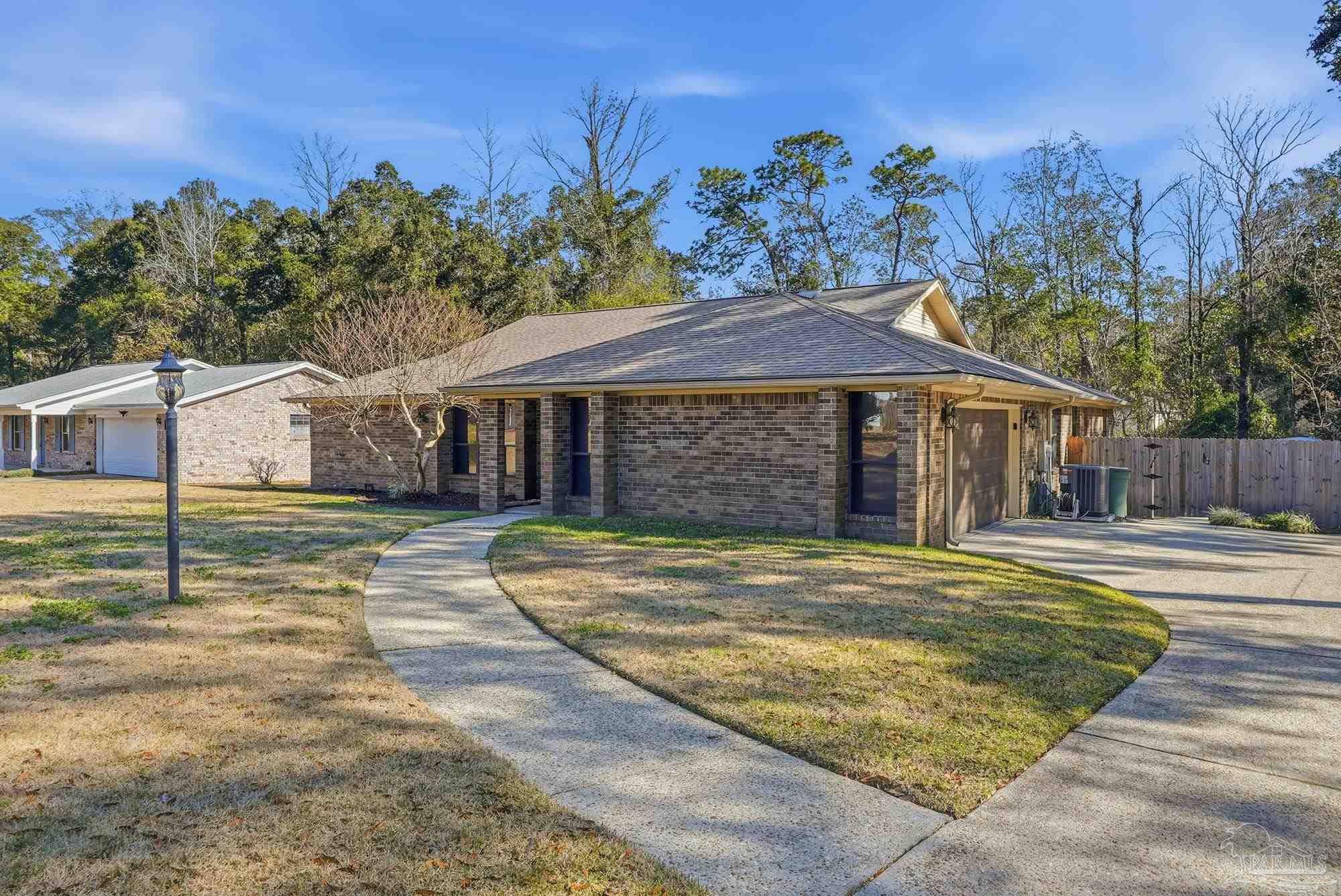 10145 Huntsman Path Pensacola, FL 32514 - Photo 3 of 47 a view of a white house with a swimming pool