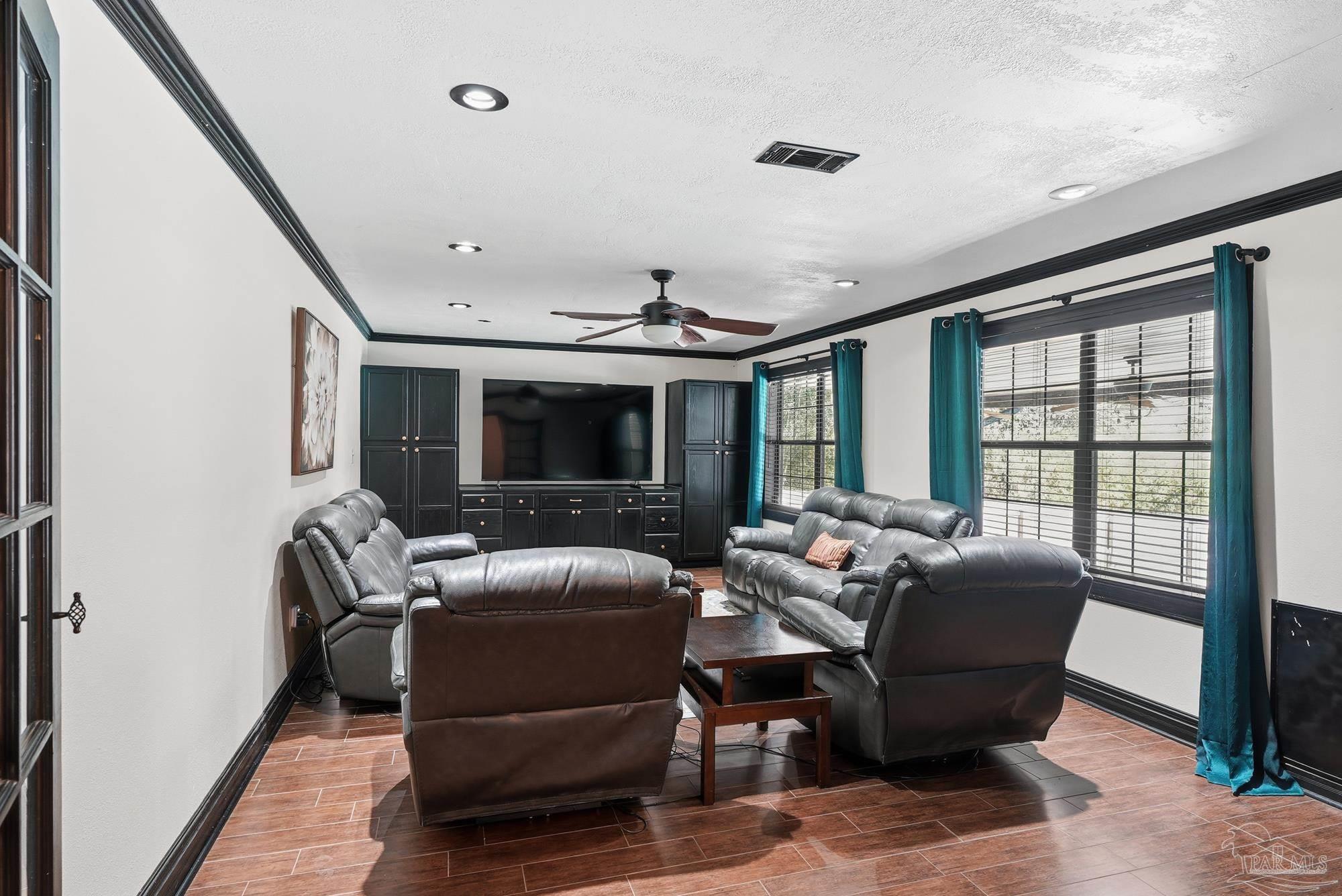10145 Huntsman Path Pensacola, FL 32514 - Photo 35 of 47 a living room with furniture and a large window