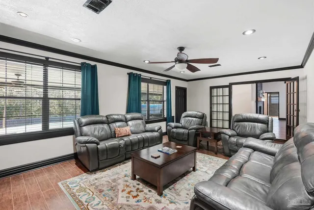 a bath room with stainless steel appliances granite countertop sink and stove