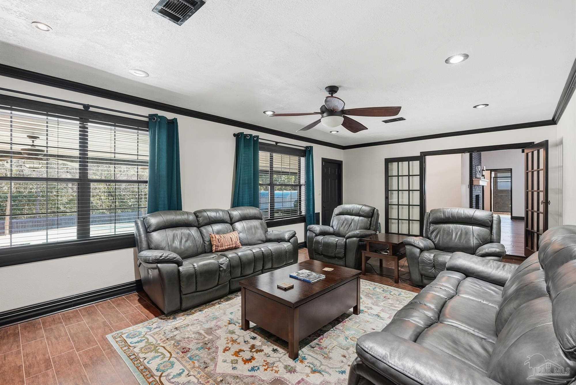 10145 Huntsman Path Pensacola, FL 32514 - Photo 37 of 47 a living room with furniture and a large window