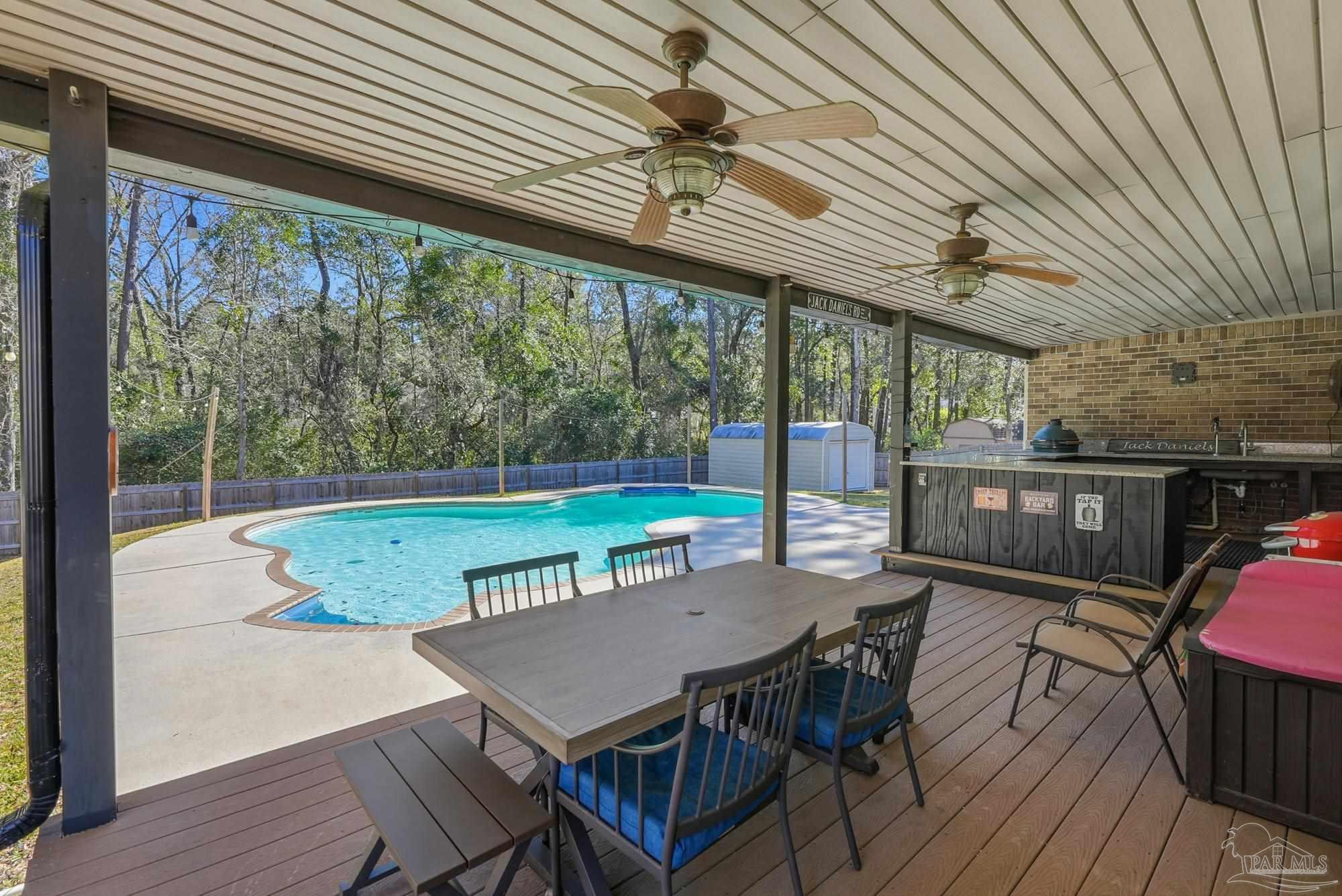 10145 Huntsman Path Pensacola, FL 32514 - Photo 40 of 47 a view of a dining room with furniture window and wooden floor