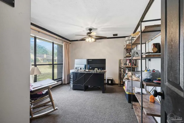 a living room with furniture a air conditioner and a window