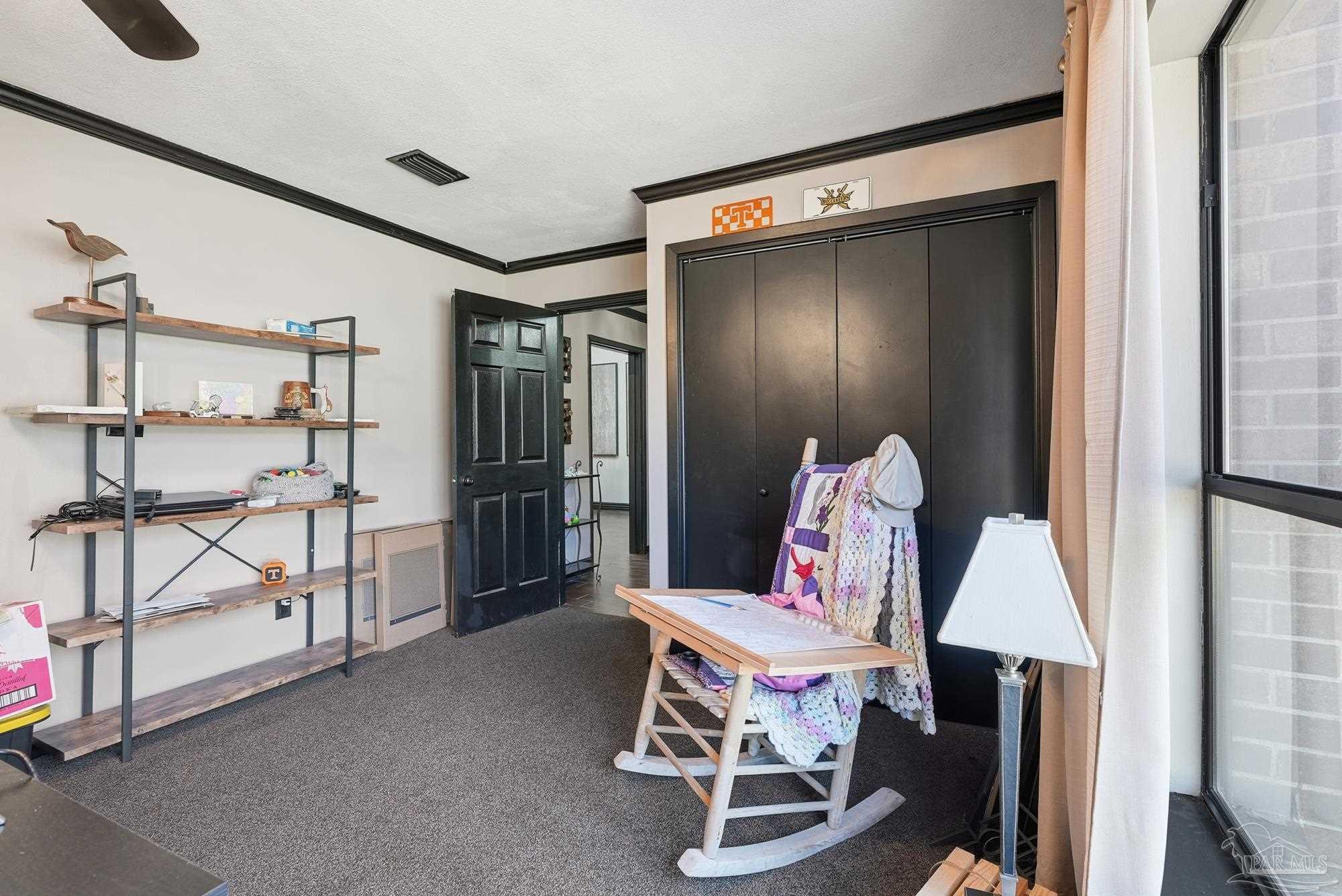 10145 Huntsman Path Pensacola, FL 32514 - Photo 9 of 47 a room with table and chairs