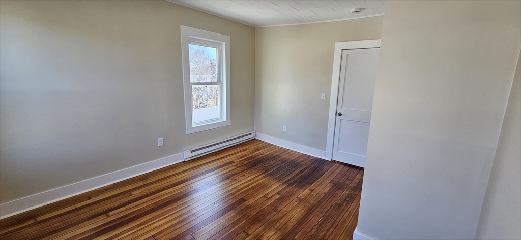 2009 High Street, Unit 2013 Three Rivers, MA 01080 - Photo 2 of 13 a view of empty room with wooden floor and fan