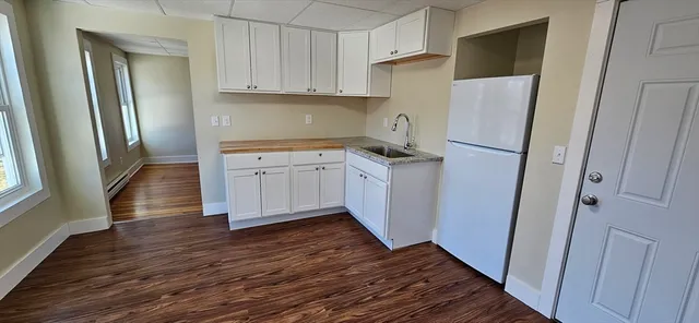 a kitchen with a refrigerator a sink and dishwasher