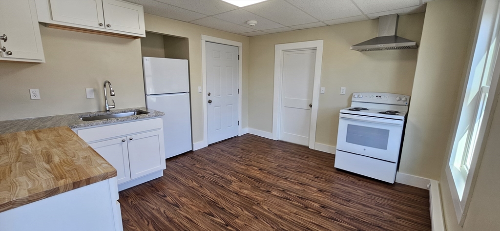 2009 High Street, Unit 2013 Three Rivers, MA 01080 - Photo 5 of 13 a kitchen with a sink stove and refrigerator