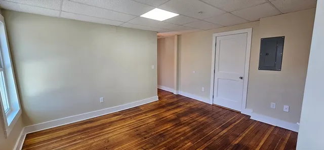 a view of room with wooden floor