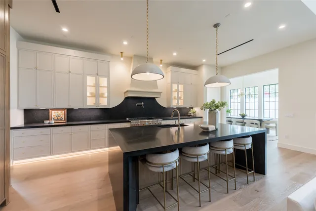 a living room with furniture a fireplace and a table