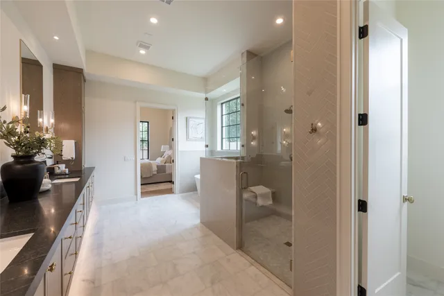 a spacious bathroom with a bathtub and a shower
