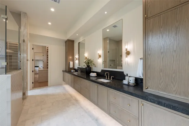 a view of an empty room with a cabinet and a window