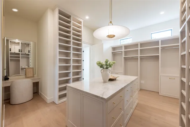a kitchen with cabinets and window